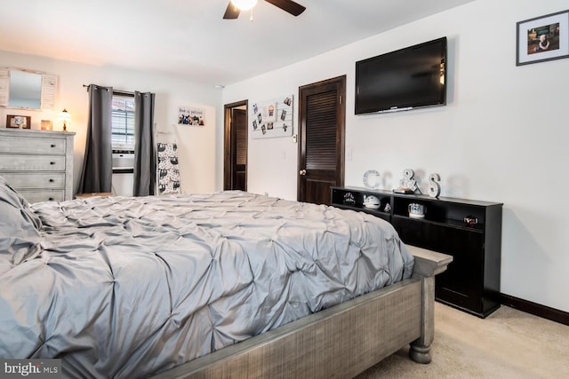 bedroom with ceiling fan and light colored carpet