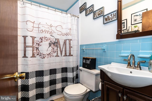 bathroom featuring toilet, tile walls, walk in shower, and vanity