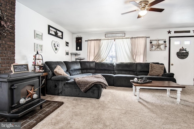 living room with ceiling fan and carpet