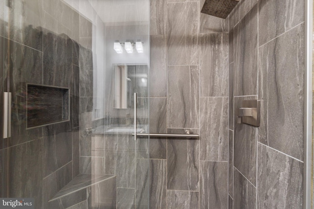 bathroom with a tile shower