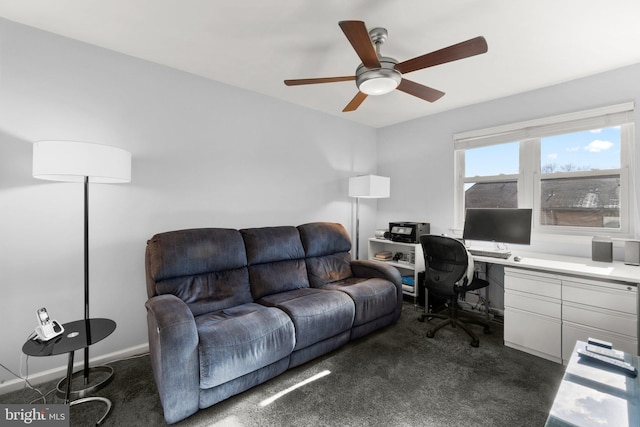 carpeted office space with ceiling fan