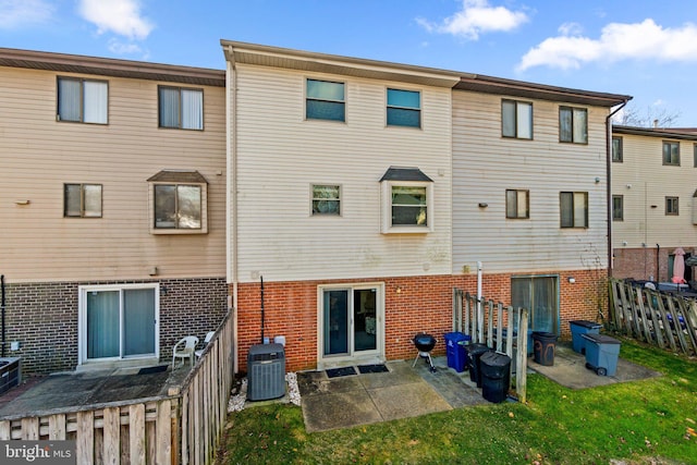 back of property with central air condition unit