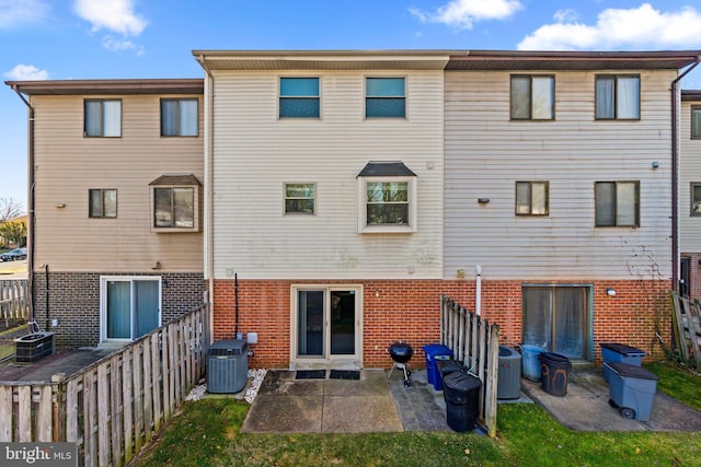 back of property featuring a patio and central AC unit