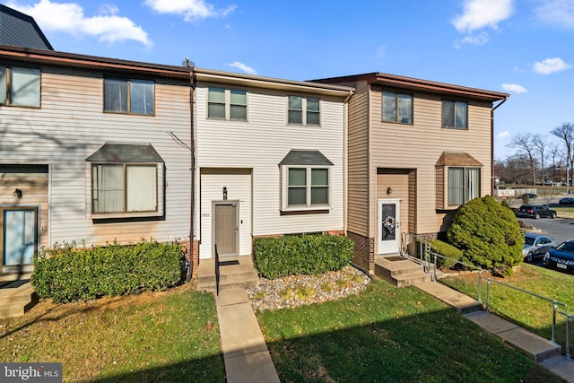 view of property with a front lawn