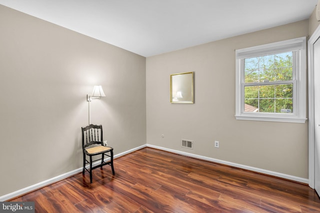 sitting room featuring dark hardwood / wood-style floors