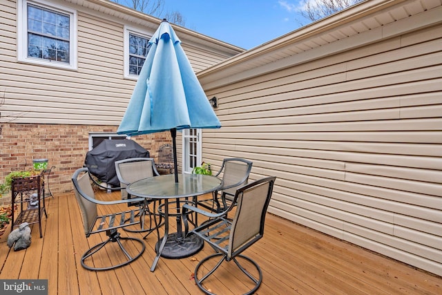 wooden terrace featuring grilling area