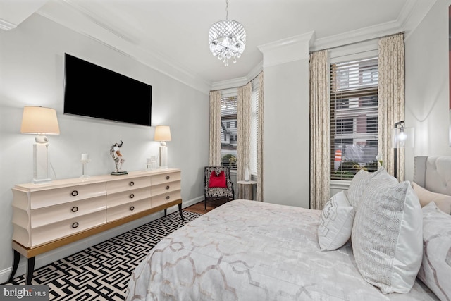 bedroom featuring hardwood / wood-style floors, a notable chandelier, and ornamental molding