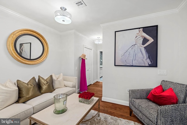 living room featuring crown molding and hardwood / wood-style floors