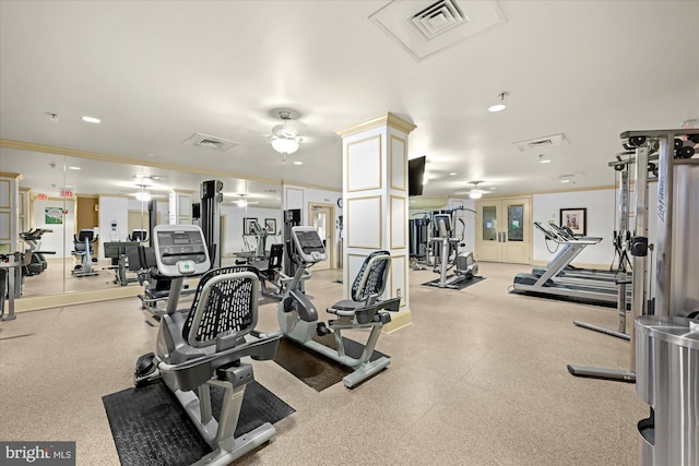 workout area featuring ceiling fan and crown molding