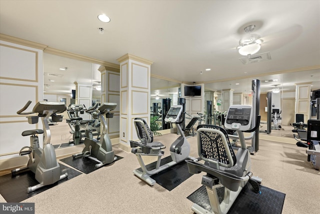 workout area with ceiling fan and crown molding