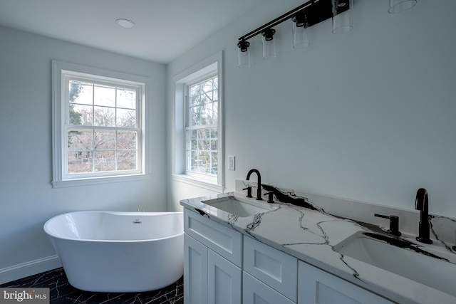 bathroom featuring a bathing tub and vanity