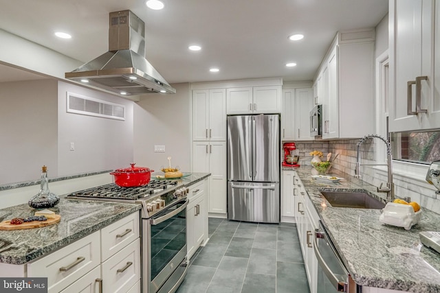 kitchen featuring ventilation hood, sink, white cabinets, and appliances with stainless steel finishes