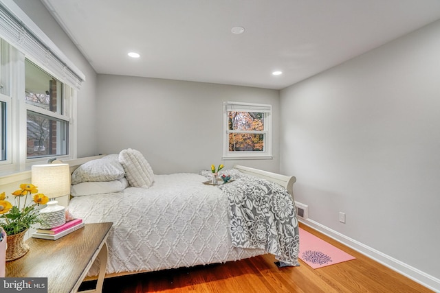 bedroom with wood-type flooring