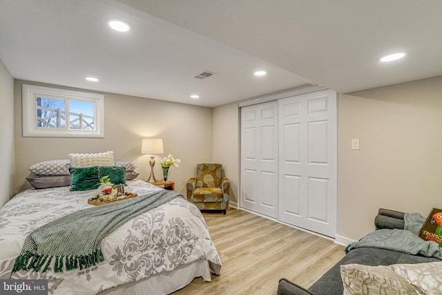 bedroom featuring a closet and light hardwood / wood-style flooring