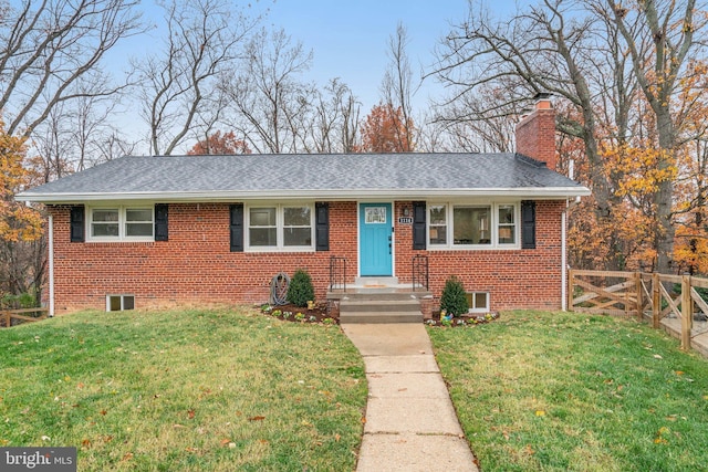 view of front of property with a front lawn