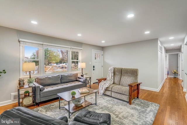 living room with light hardwood / wood-style floors