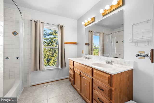 bathroom with tile patterned flooring, vanity, and shower / bath combination with curtain