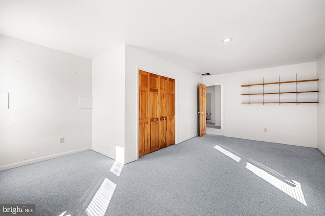 unfurnished room with light carpet