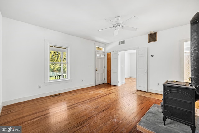 living room featuring wood-type flooring and ceiling fan