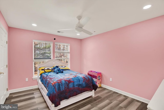 bedroom featuring ceiling fan and hardwood / wood-style flooring