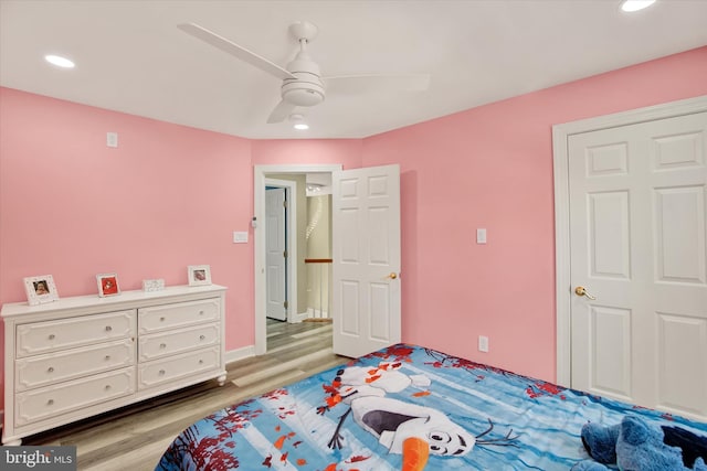 bedroom featuring ceiling fan and light hardwood / wood-style flooring