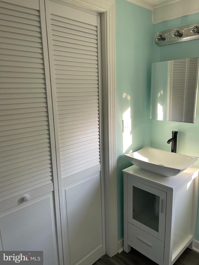 bathroom with hardwood / wood-style floors and vanity