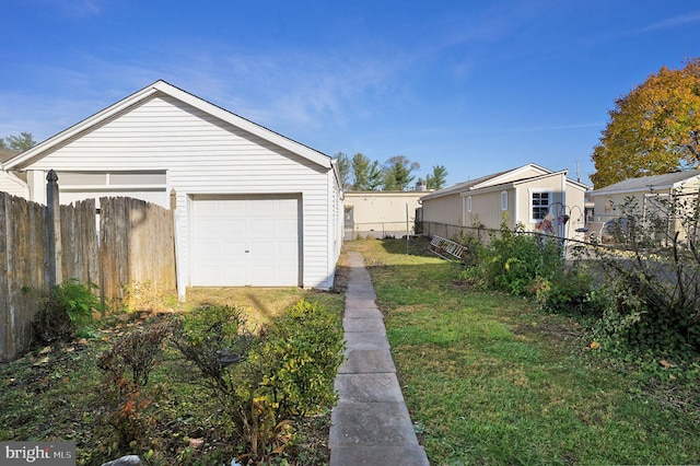 garage with a yard