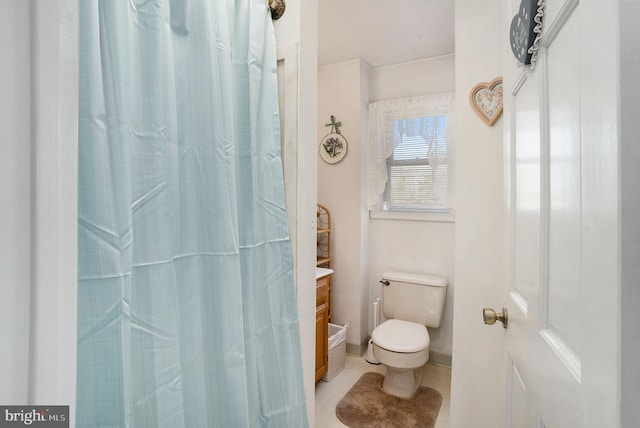 bathroom with tile patterned floors, vanity, and toilet