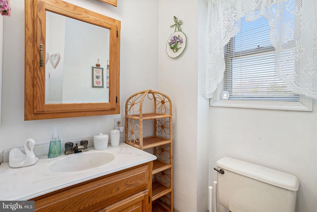 bathroom with vanity and toilet