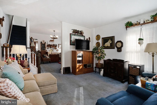 carpeted living room with a chandelier