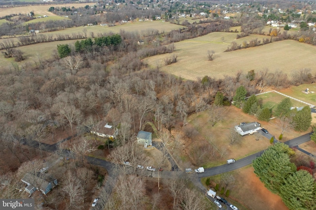 birds eye view of property with a rural view