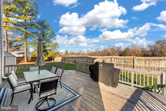 wooden deck featuring area for grilling