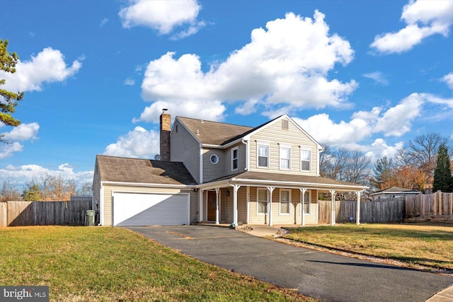 view of front facade with covered porch, a garage, and a front lawn