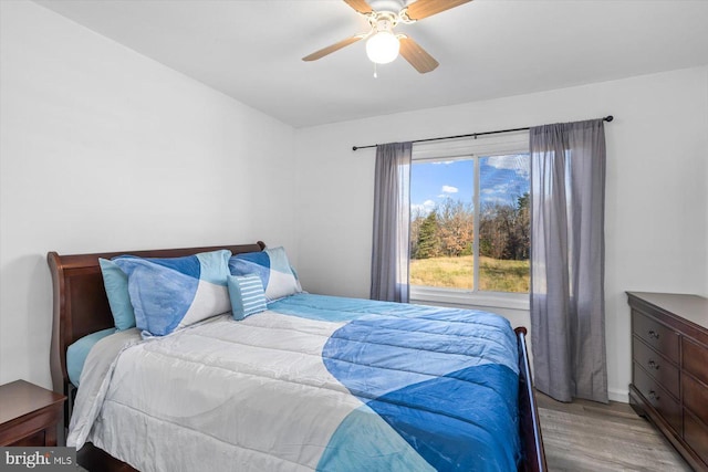 bedroom featuring light hardwood / wood-style floors and ceiling fan