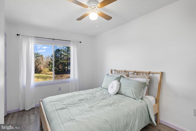 bedroom featuring ceiling fan and wood-type flooring