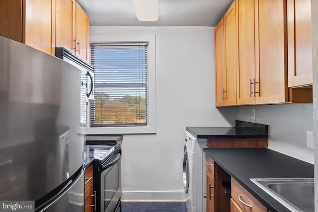 washroom with washer / clothes dryer and sink