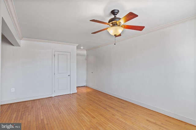 empty room with ceiling fan, light hardwood / wood-style flooring, and ornamental molding