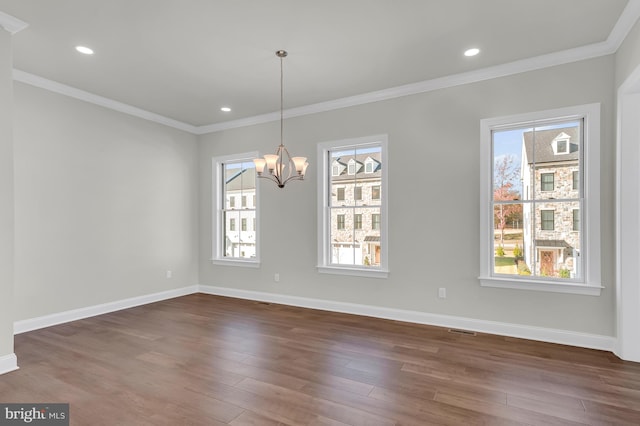 unfurnished dining area featuring ornamental molding, dark wood finished floors, and baseboards