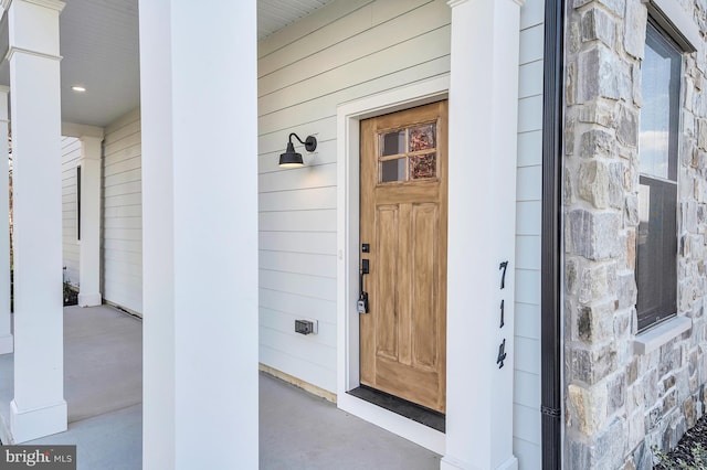 entrance to property with stone siding