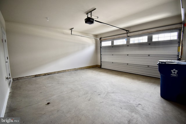 714 Walkers Mill Ln, Wilmington, DE 19807 - garage with a garage door opener and baseboards