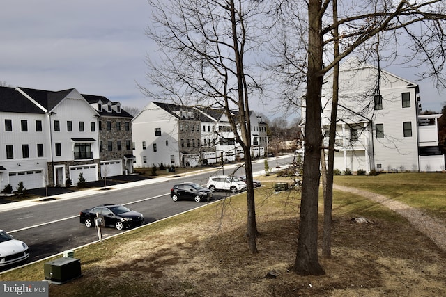 view of road featuring sidewalks and a residential view