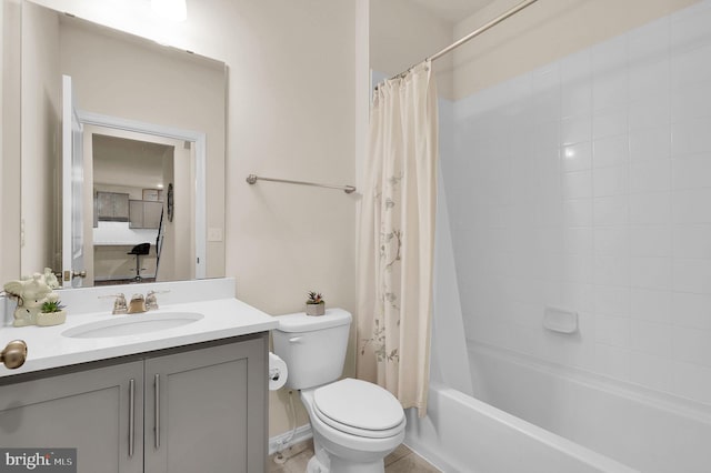 full bathroom with tile patterned flooring, shower / bath combo, vanity, and toilet