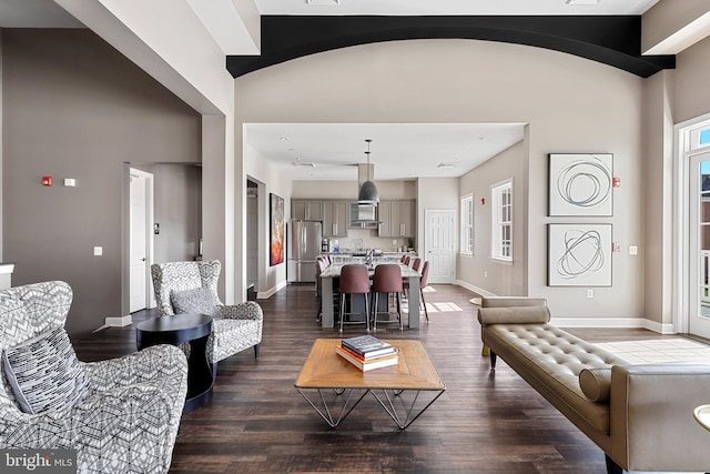 living room with plenty of natural light and wood-type flooring