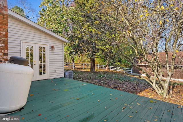 wooden terrace featuring central AC unit