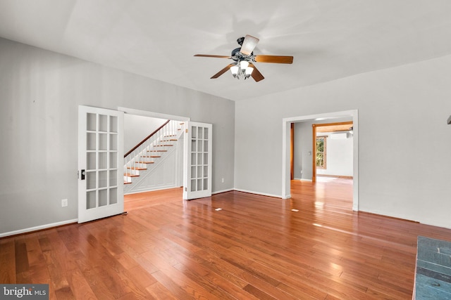 unfurnished room featuring ceiling fan, french doors, and wood-type flooring