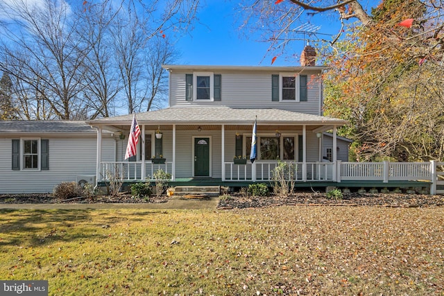 farmhouse inspired home featuring a front lawn