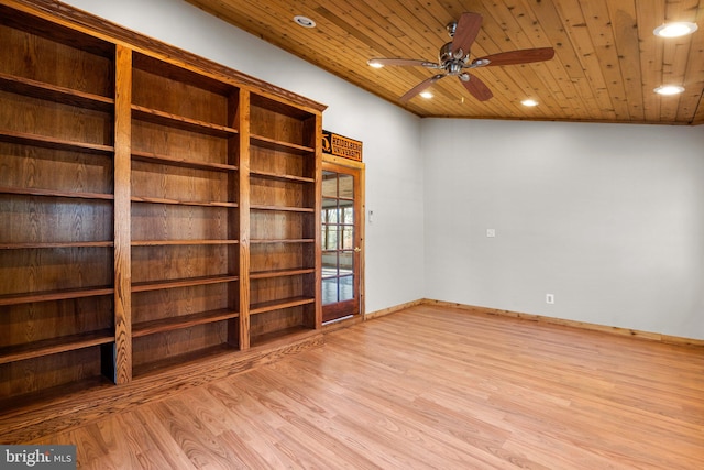 unfurnished room with lofted ceiling, light wood-type flooring, and wood ceiling