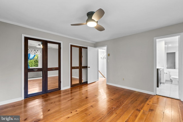 spare room with ceiling fan, wood-type flooring, and ornamental molding