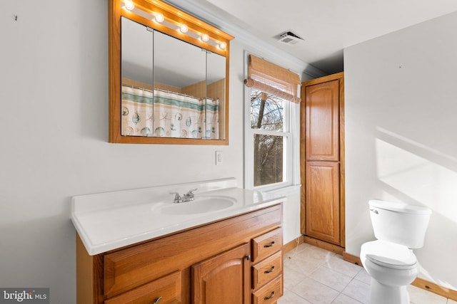 bathroom with tile patterned floors, vanity, a shower with shower curtain, and toilet