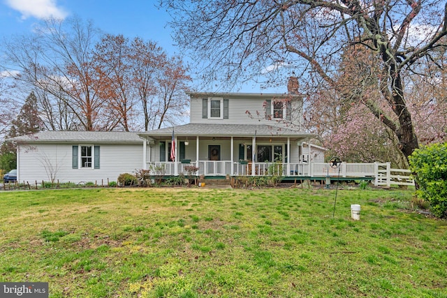 view of front of house featuring covered porch and a front yard